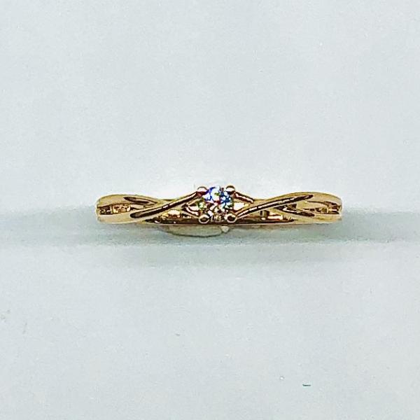 14 karátos vörös arany brill gyűrű. Tisztasága és színe a nemzetközi besorolás szerint: vs,g, nagysága 0,06ct.