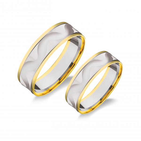 Sárga és fehér színű. Finom hullámvonalban vésett. Belül sima.