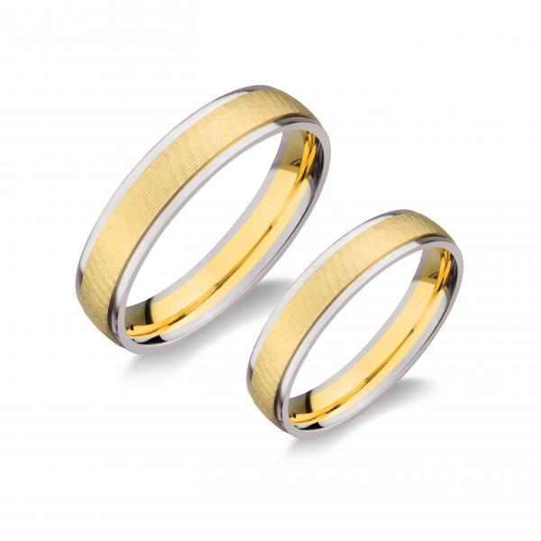 Kétszínű, sárga és fehér. Felülete finom ívesre vésett és fényes.
Tetszés szerinti kövezéssel (cirkonia vagy brill). Kívül, belül finoman hajlított/domború/.